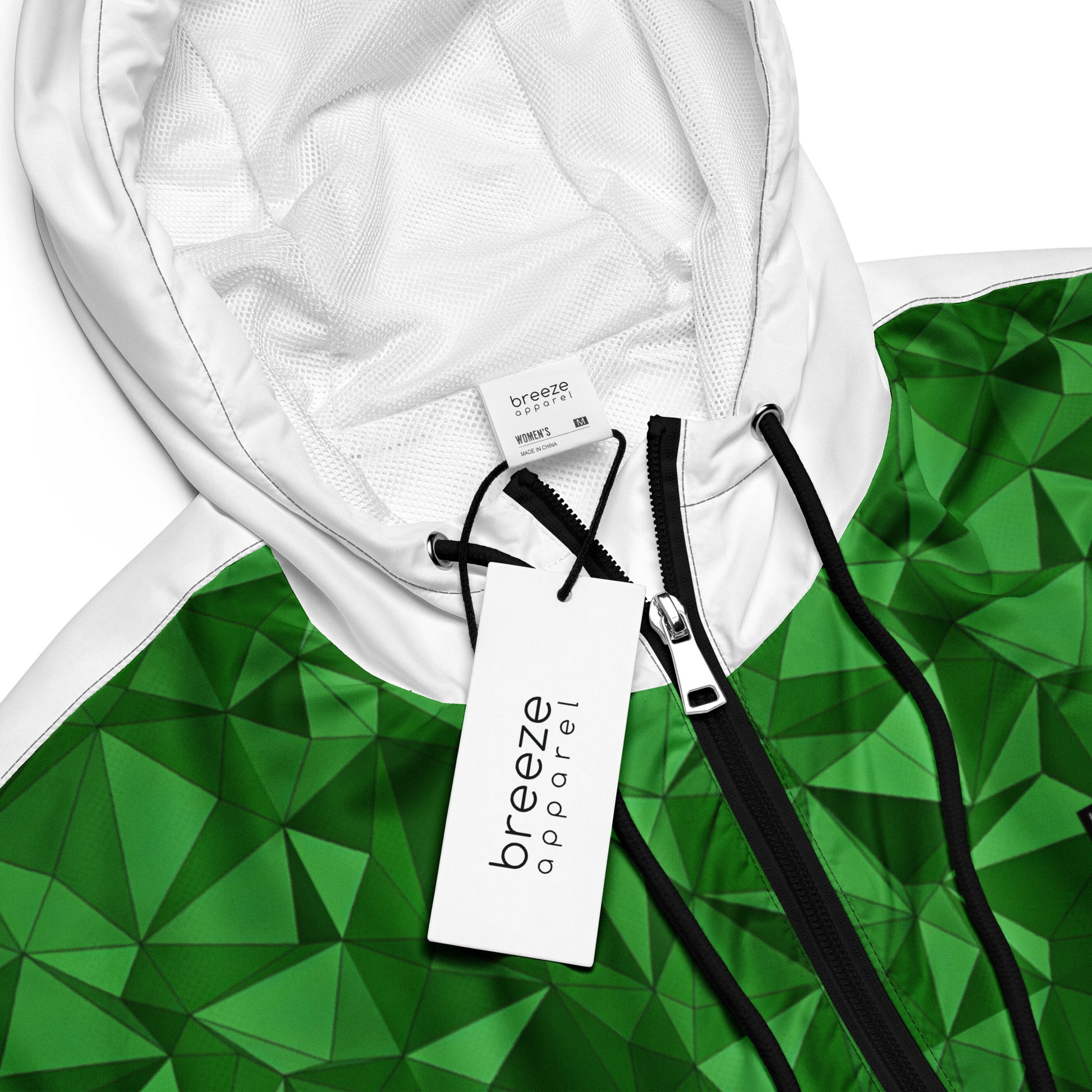 Windbreaker with green geometric pattern.