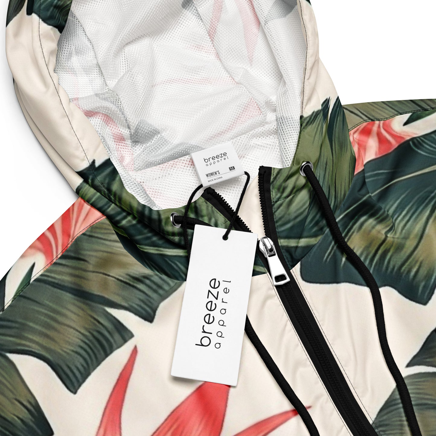 Cropped windbreaker with tropical floral design.