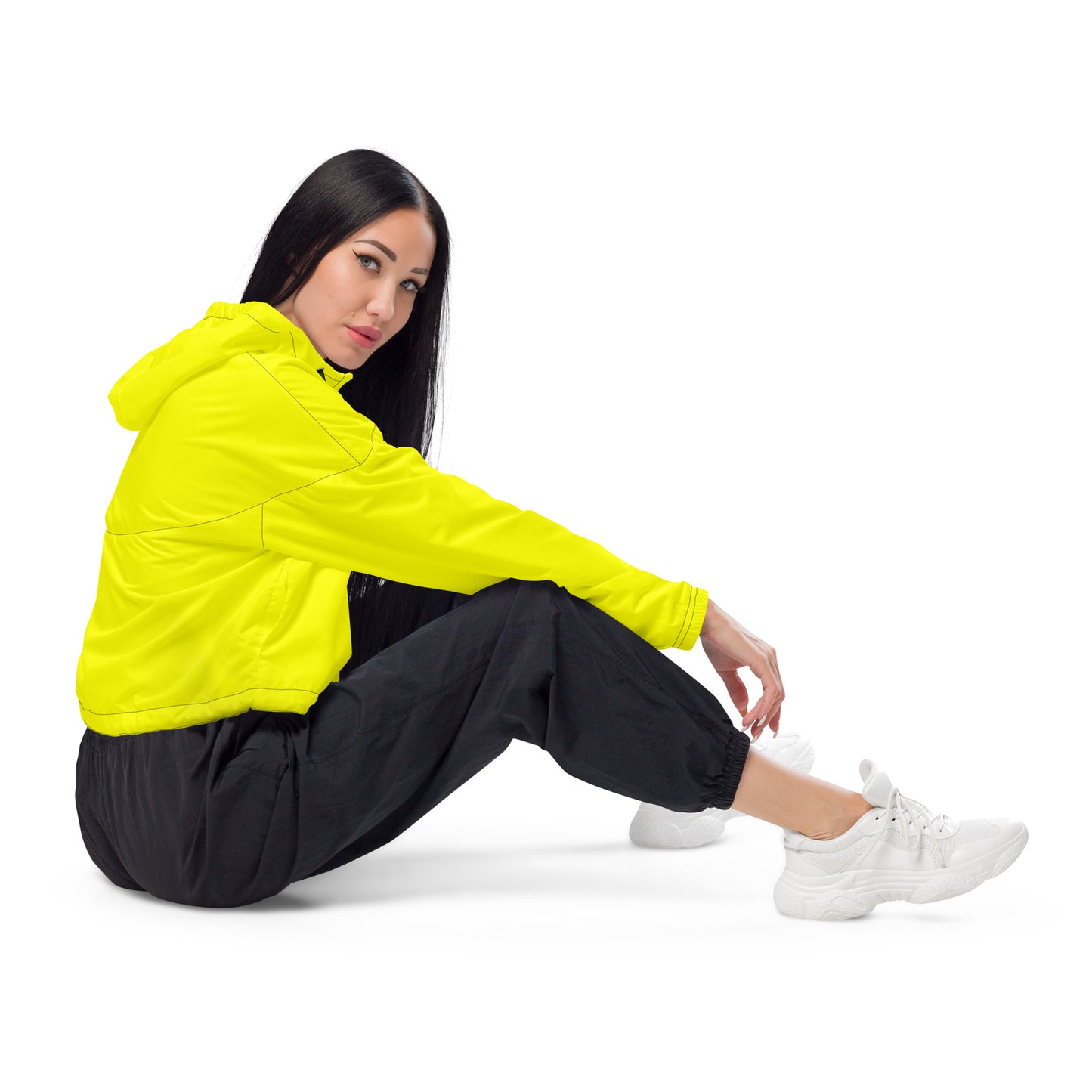 Woman wearing yellow cropped jacket.