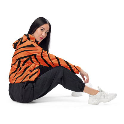 Woman wearing cropped jacket with tigerskin pattern.