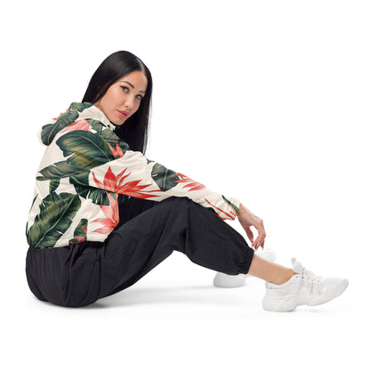 Woman wearing cropped windbreaker with tropical floral design.