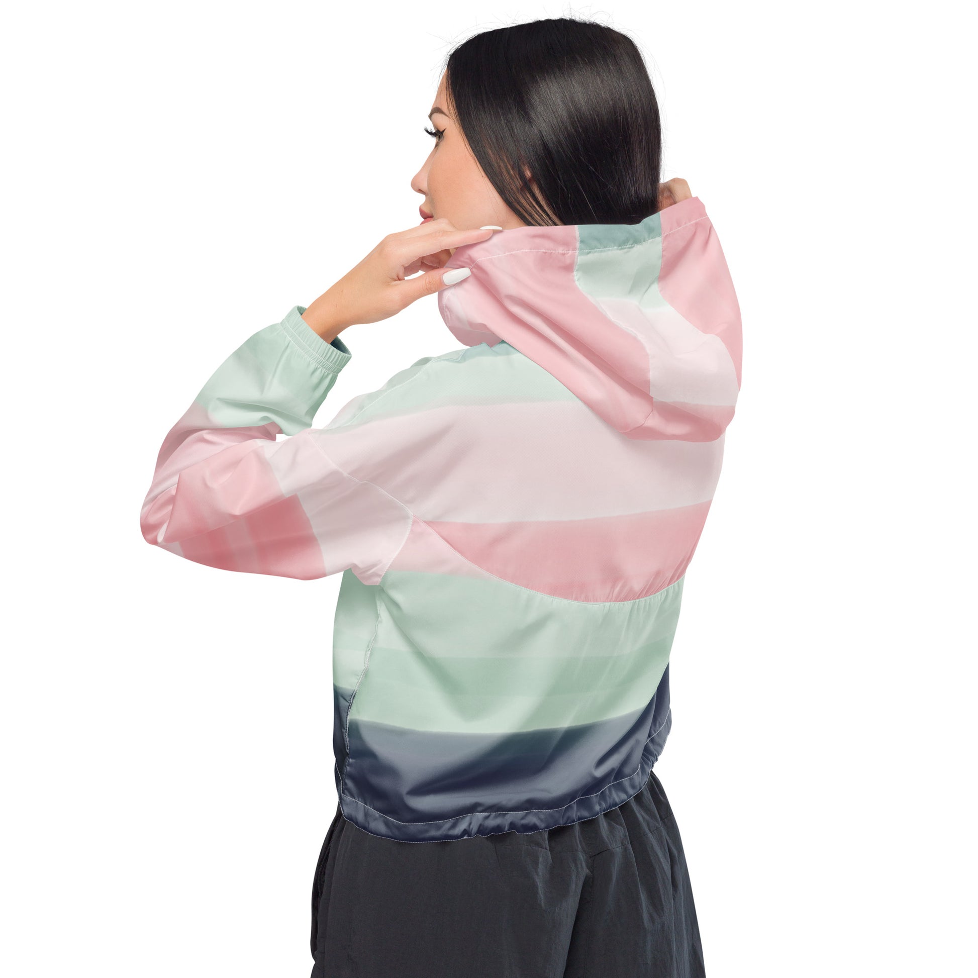 Woman wearing cropped jacket with pattern resembling watercolor. Colors included are gray, light-green, and shades of pink.