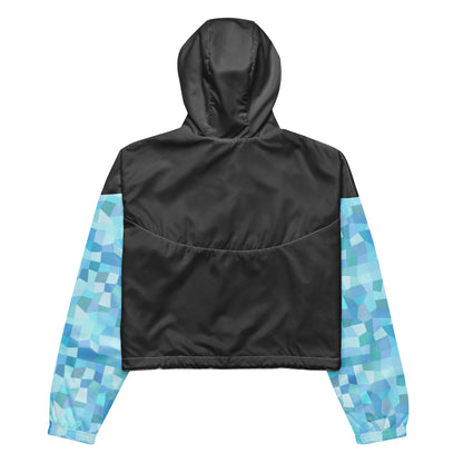 Gray back of cropped jacket; sleeves have light-blue geometric pattern.