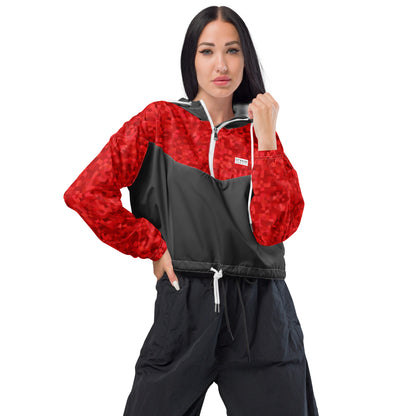 Woman wearing cropped jacket with red geometric pattern on top and sleeves; rest is gray.