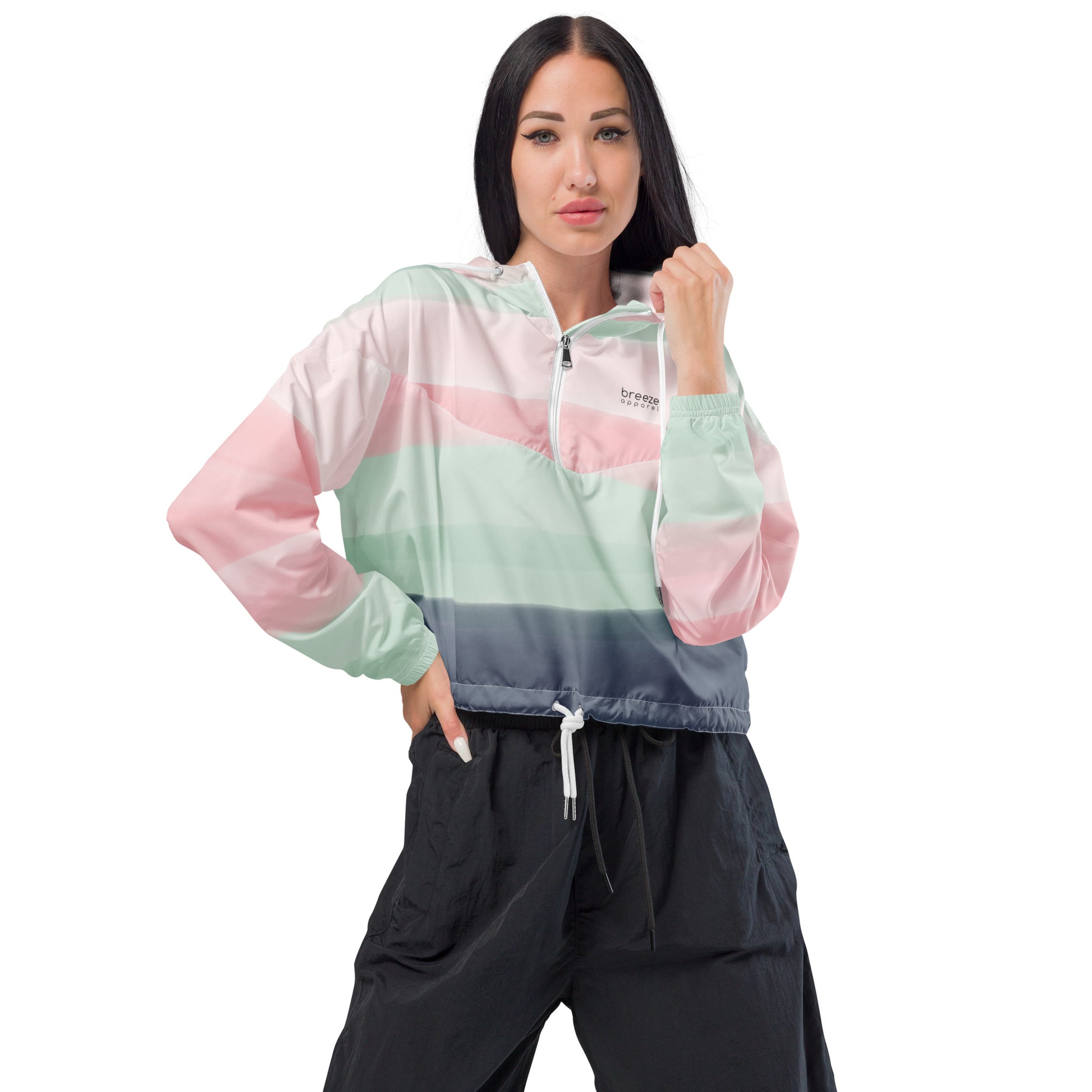 Woman wearing cropped jacket with pattern resembling watercolor. Colors included are gray, light-green, and shades of pink.