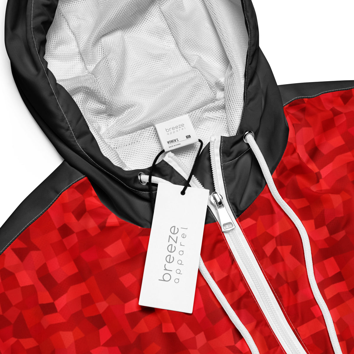 Cropped jacket with red geometric pattern.