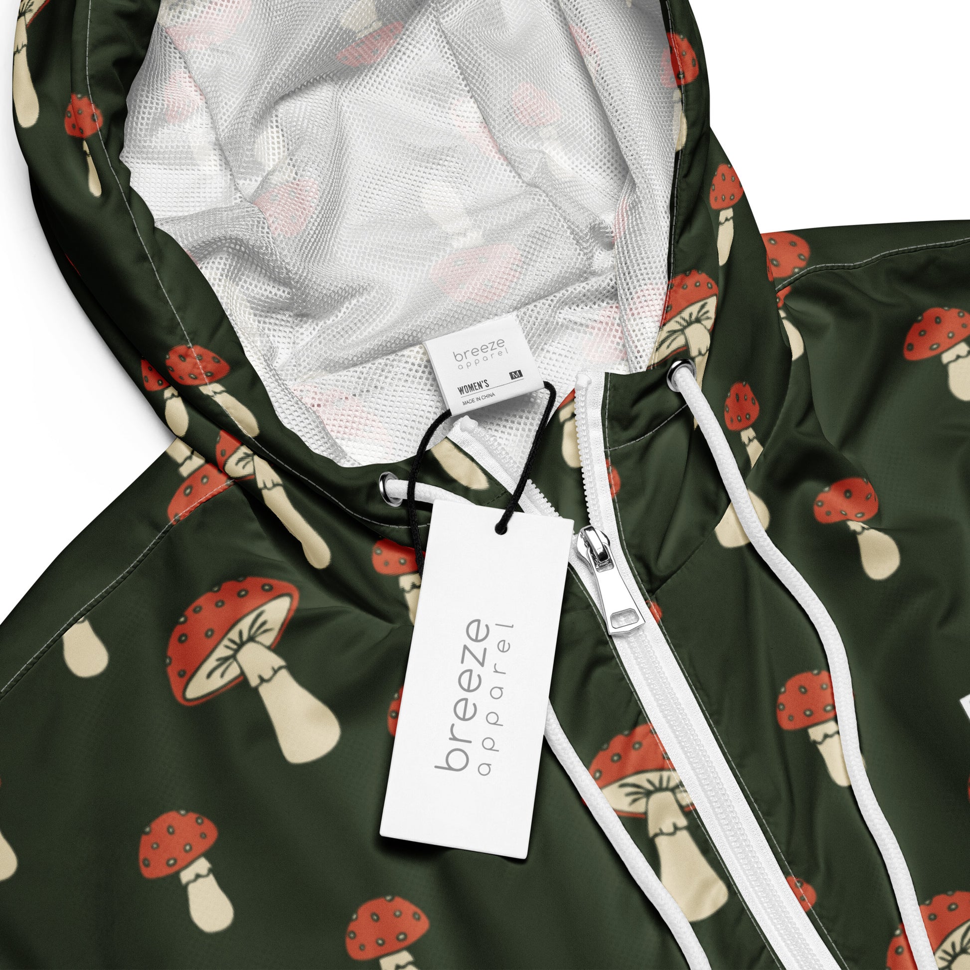 Jacket with pattern of mushrooms set on a green background.
