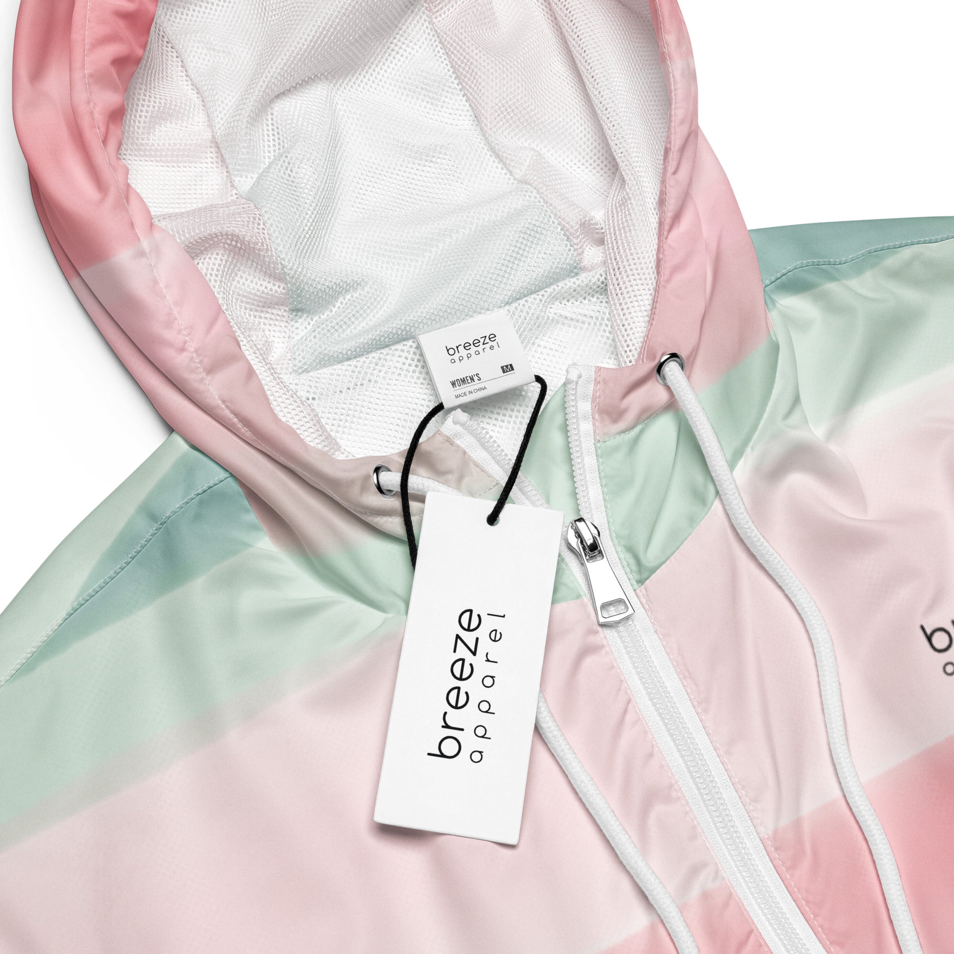 Jacket with pattern resembling watercolor. Colors included are gray, light-green, and shades of pink.