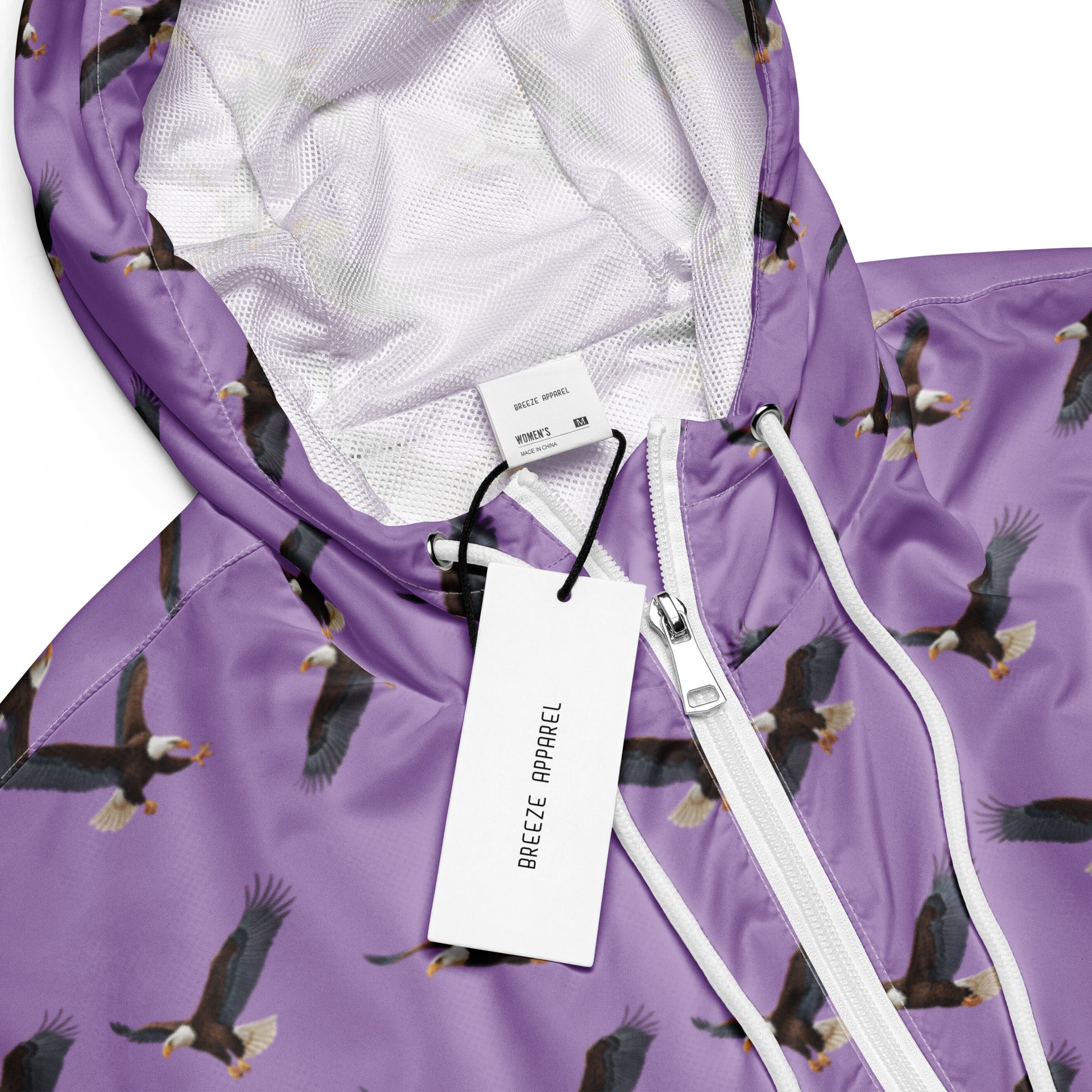 Cropped, purple windbreaker with pattern of bald eagles.