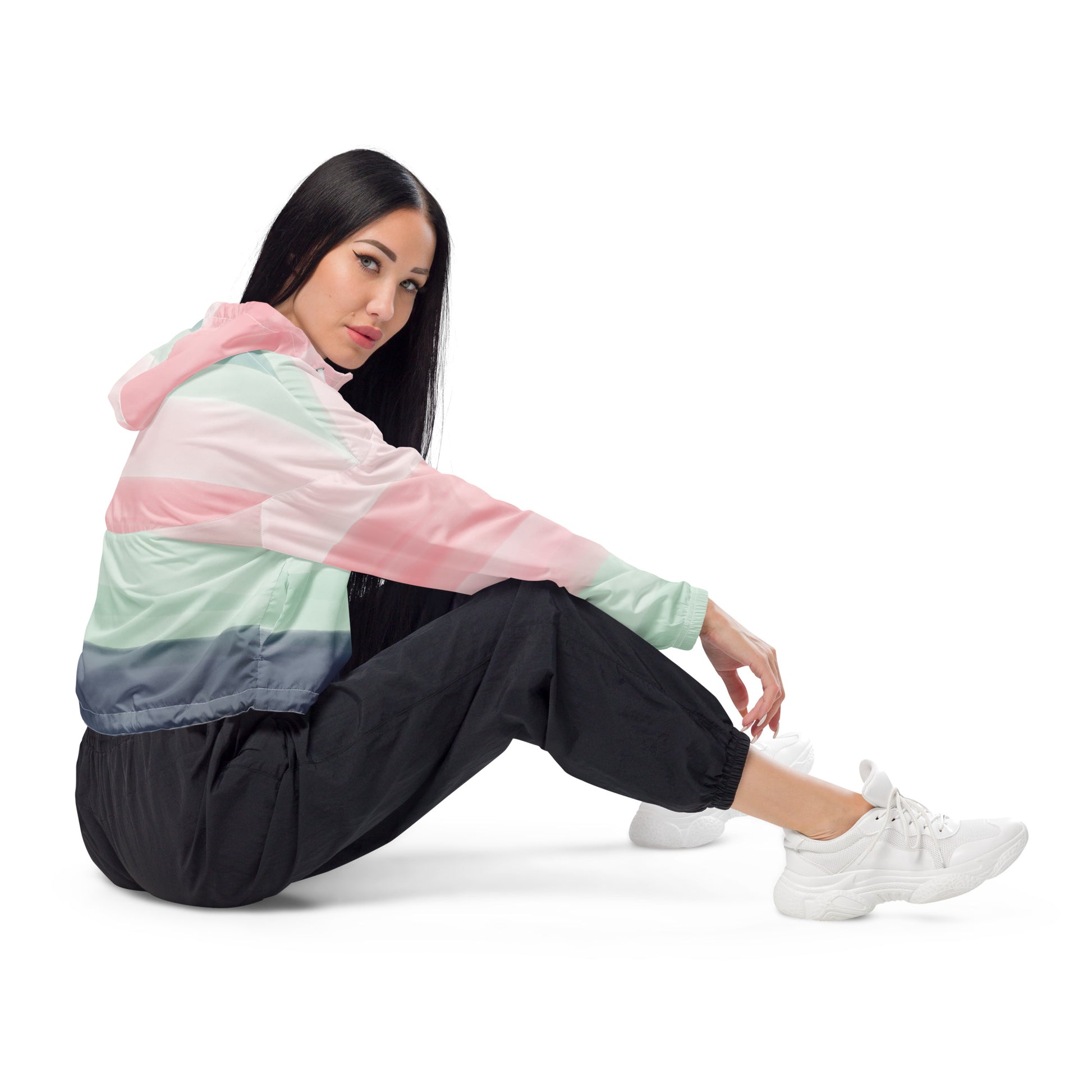 Woman wearing cropped jacket with pattern resembling watercolor. Colors included are gray, light-green, and shades of pink.