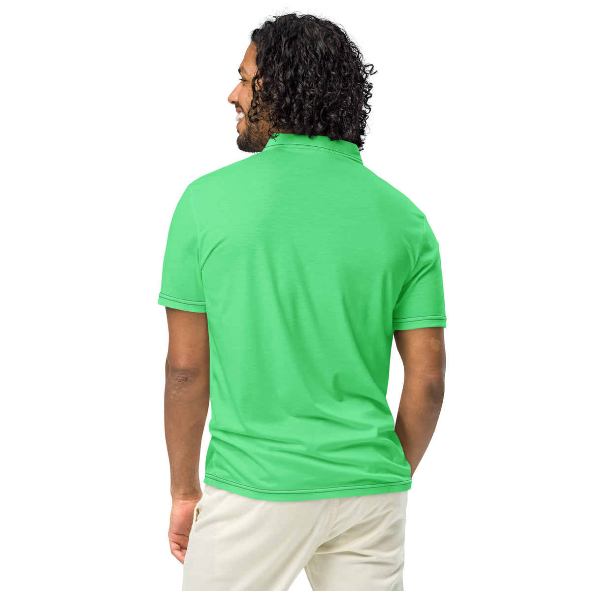 Rear view of man wearing green polo shirt 