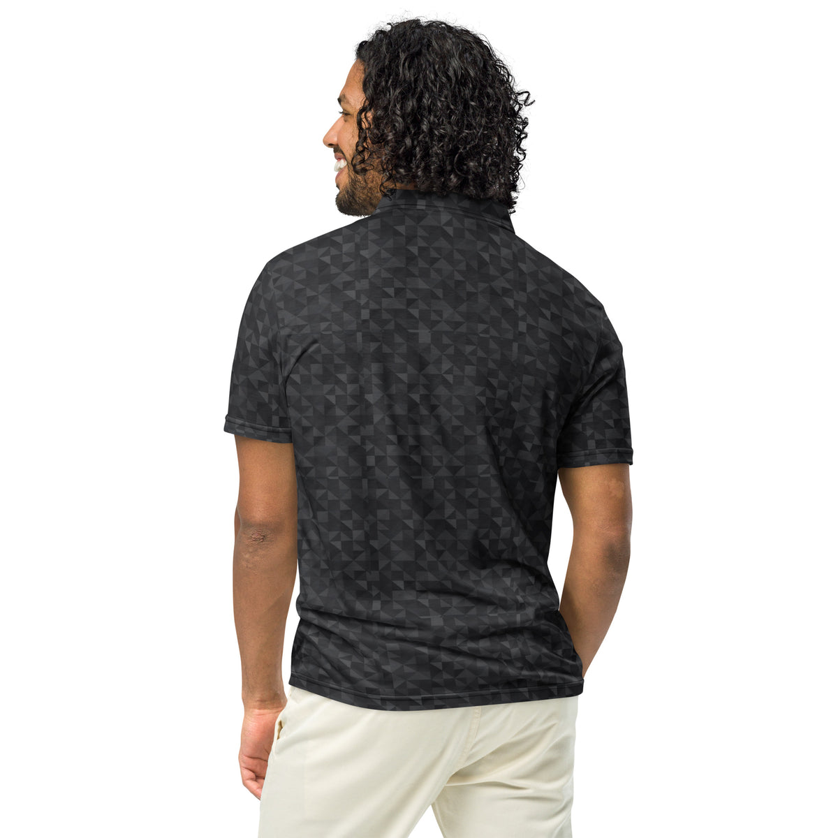 Rear view of man wearing polo shirt with dark-gray geometric pattern.