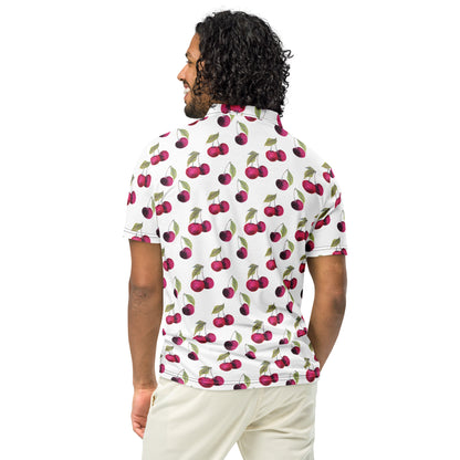 Rear view of man wearing polo with pattern of cherries set on a white background.