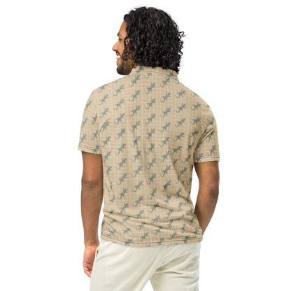 Man wearing beige polo shirt with pattern of green geckos.