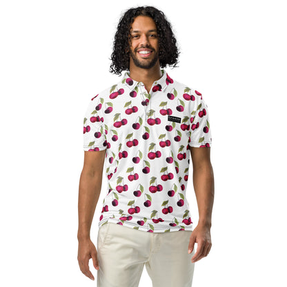 Man wearing polo with pattern of cherries set on a white background.