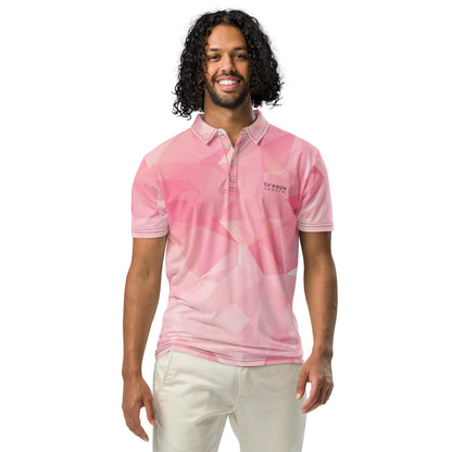 Man wearing polo shirt with pink geometric pattern.