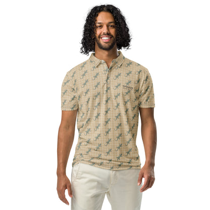 Man wearing beige polo shirt with pattern of green geckos.