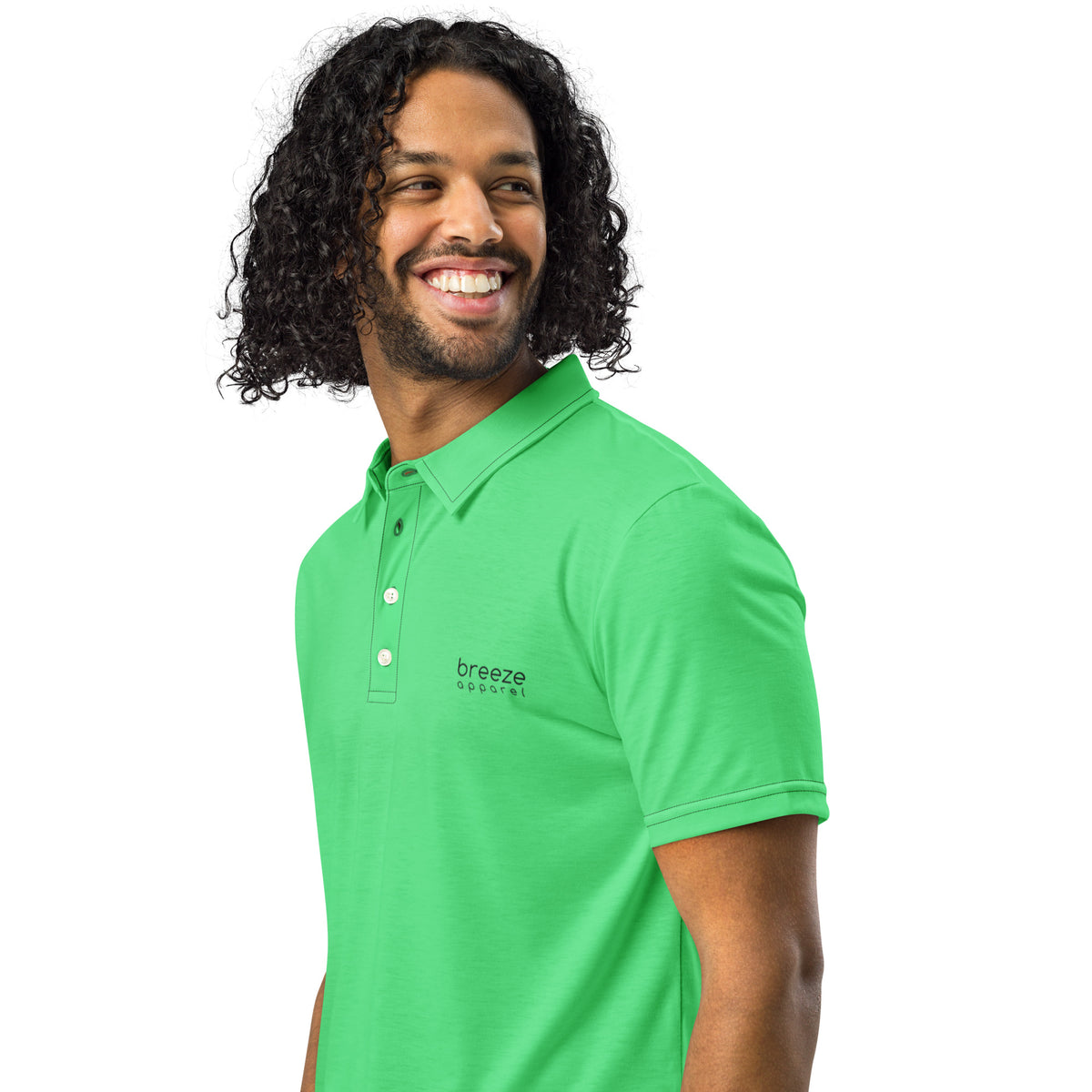 Man wearing green polo shirt with 'breeze apparel' in black over heart