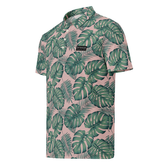 Polo with pattern of green palm leaves set on a light-pink background.