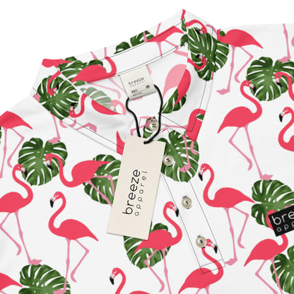 Polo with pattern of pink flamingos and green palm leaves set on a white background. Sleeves are pink.