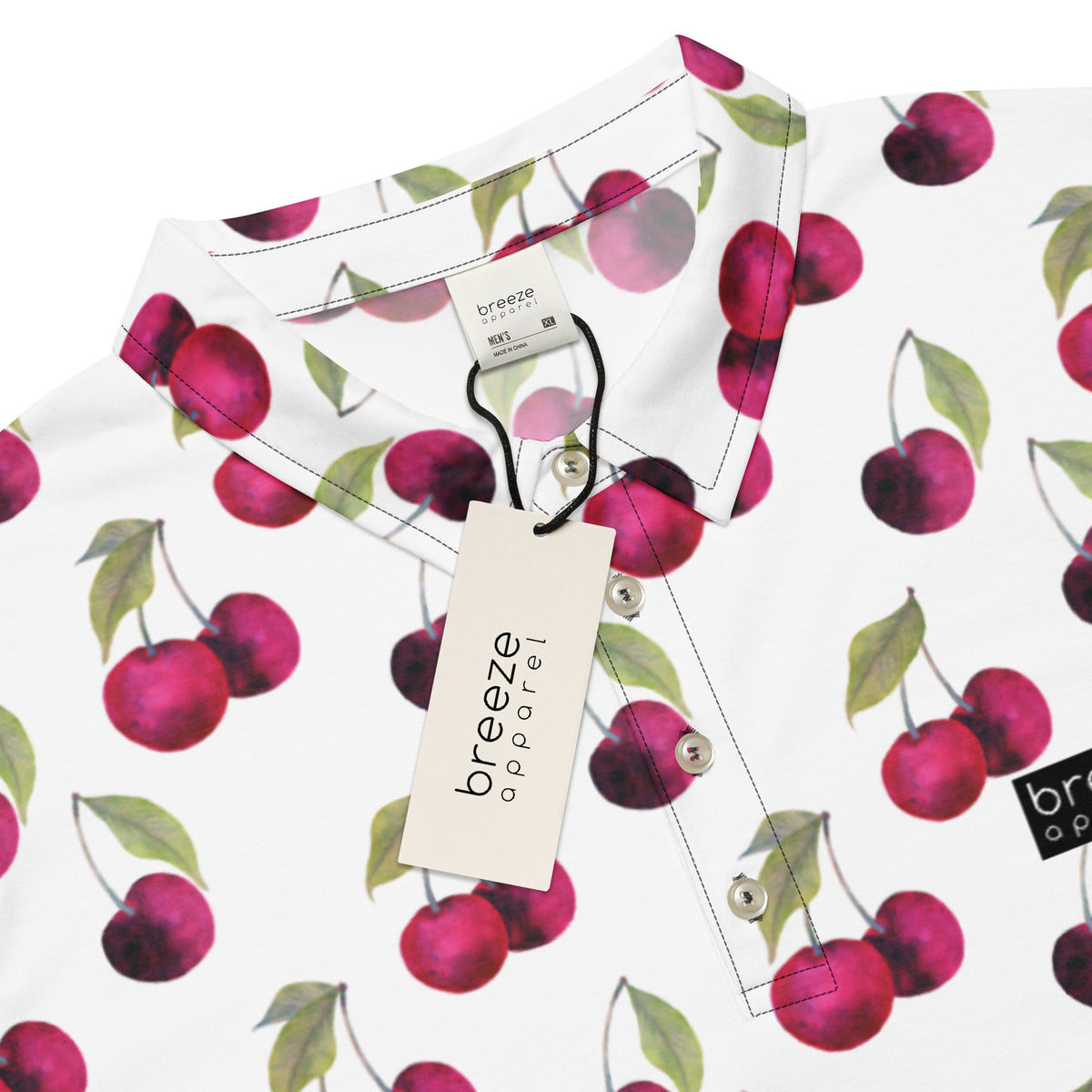 Polo with pattern of cherries set on a white background.
