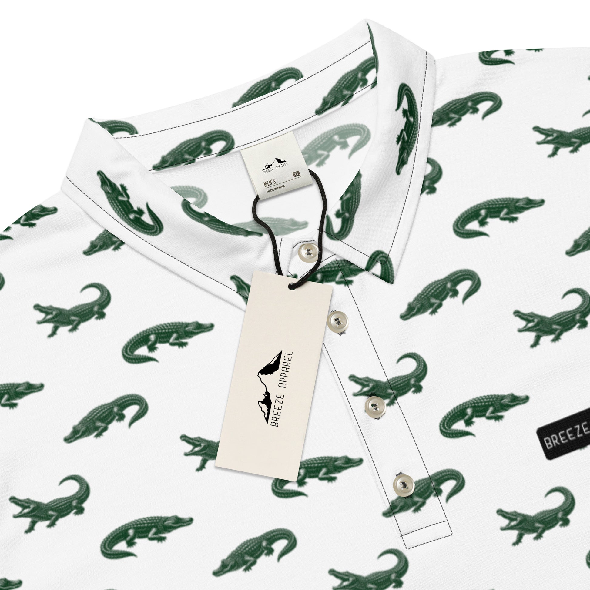 White polo with pattern of green alligators.