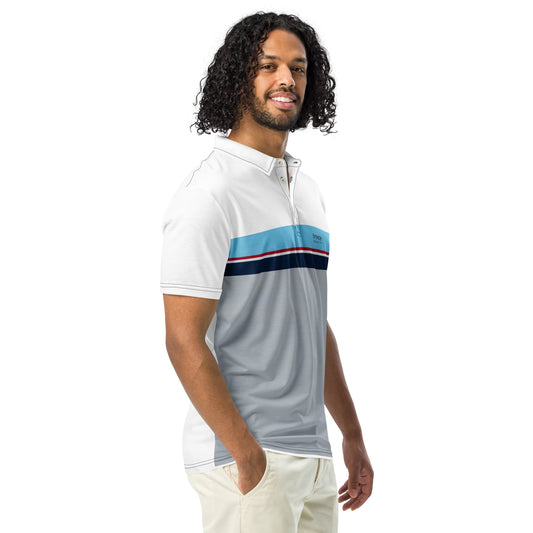 Man wearing polo shirt with horizontal blue, red, white, and navy stripe with small black 'breeze apparel' logo. Under the stripe until the bottom is gray.