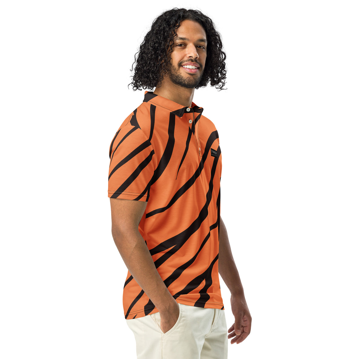 Man wearing polo shirt with tigerskin pattern.