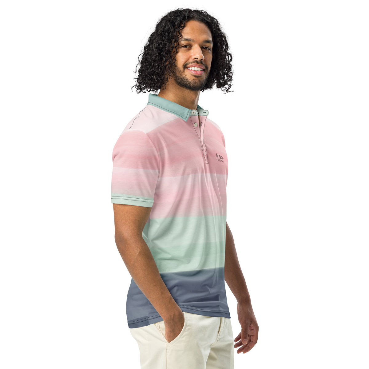 Man wearing polo shirt with design resembling watercolor stripes. Main colors are light-green and pink.