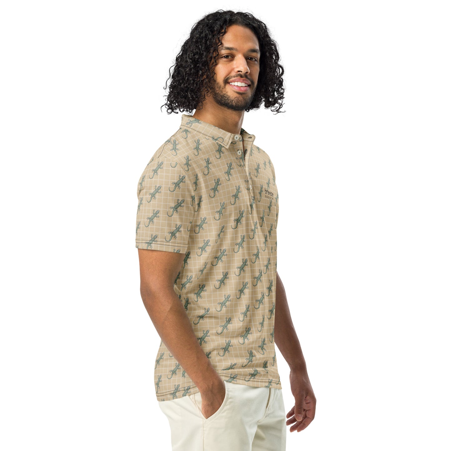 Man wearing beige polo shirt with pattern of green geckos.