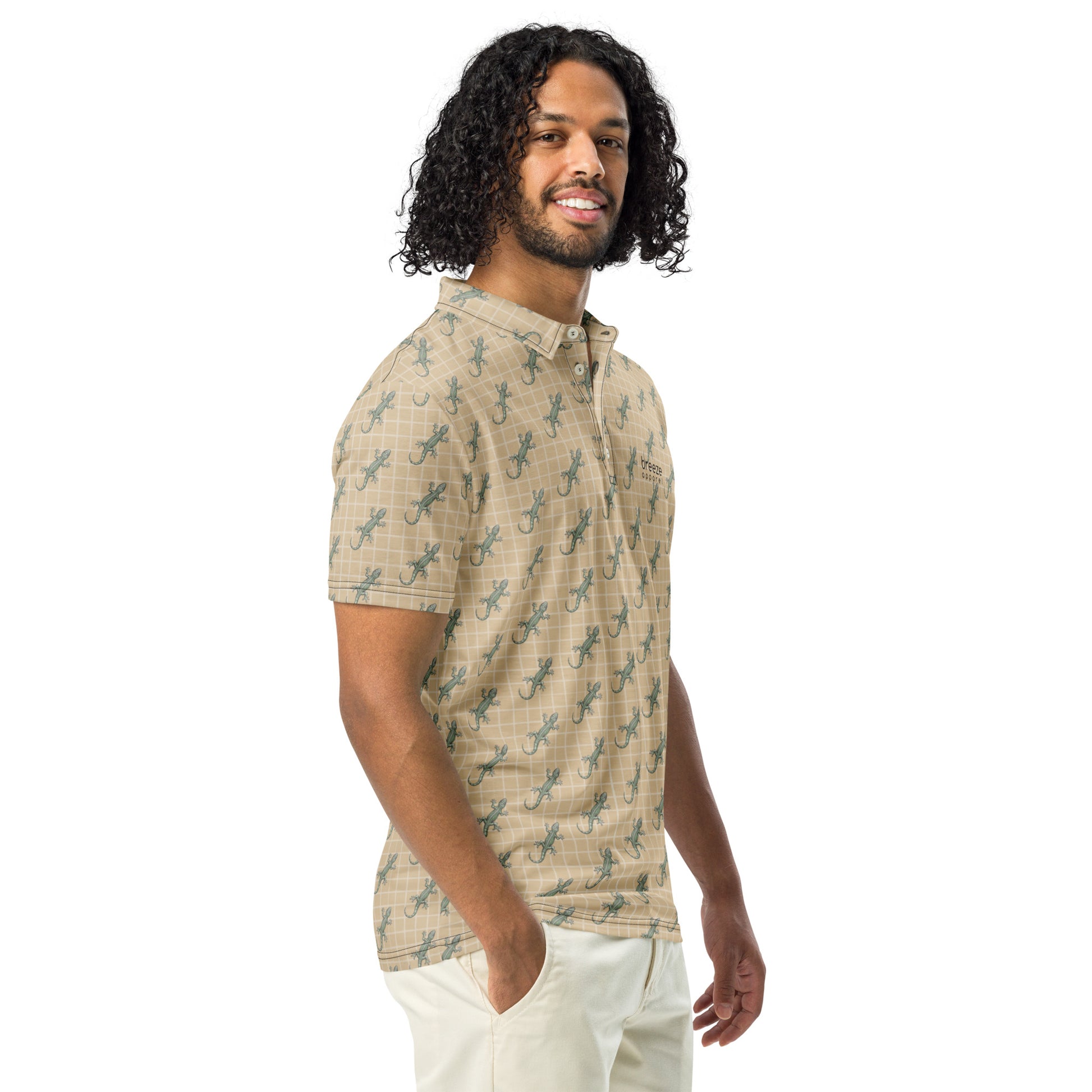 Man wearing beige polo shirt with pattern of green geckos.