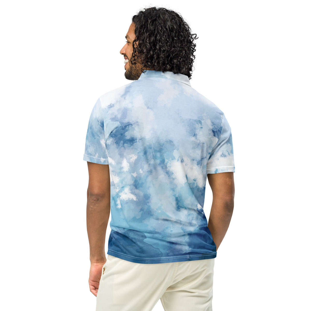 Rear view of man wearing polo shirt with blue watercolor design.