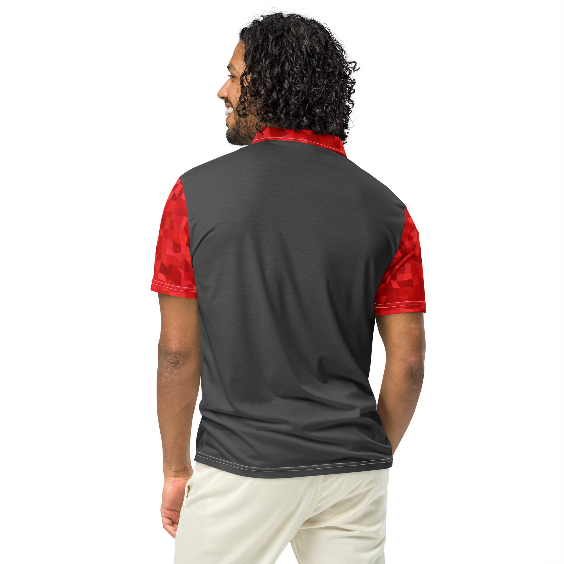 Rear view of man wearing polo shirt with dark-gray back. Collar and sleeves have red geometric pattern.