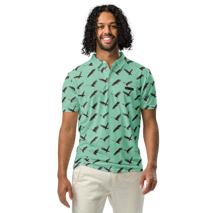 Man wearing green polo shirt with pattern of bald eagles.