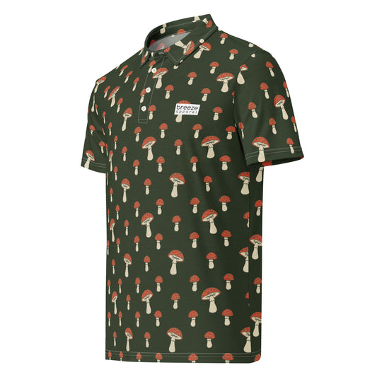 Polo with pattern of white-and-red mushrooms set on a dark-green background.