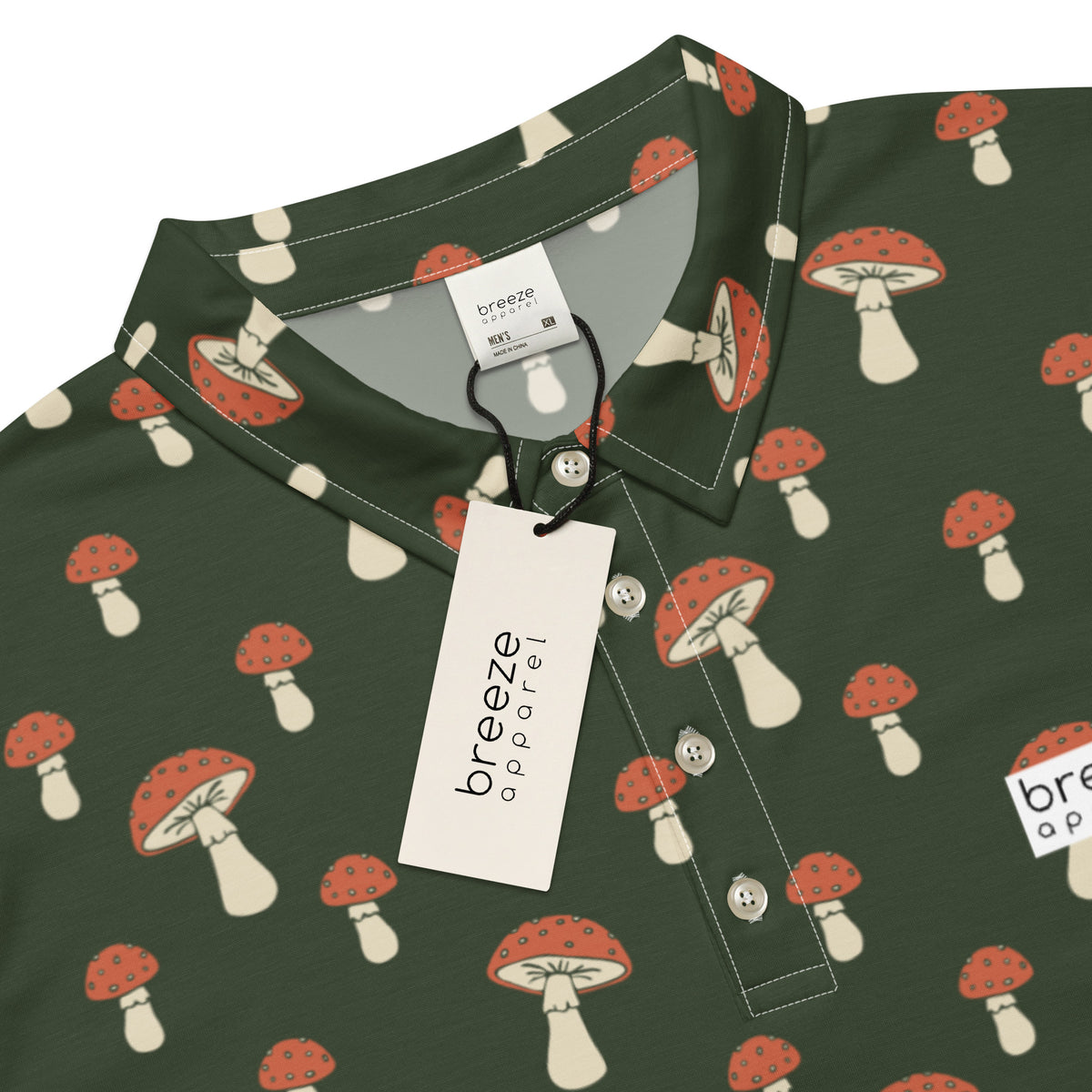 Polo with pattern of white-and-red mushrooms set on a dark-green background.