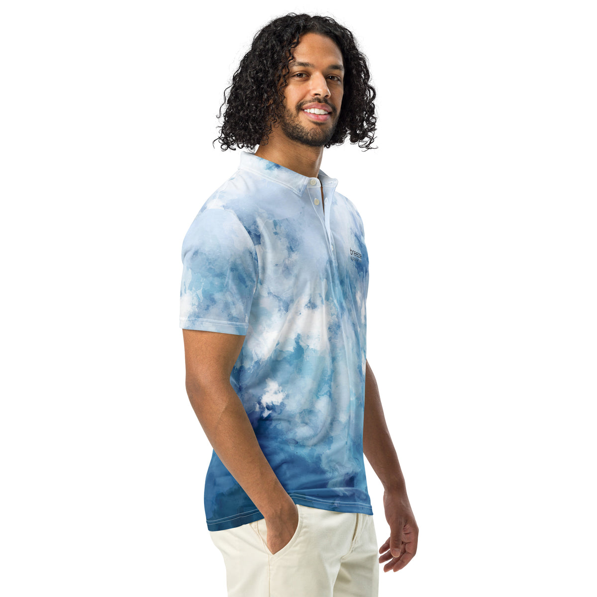 Man wearing polo shirt with blue watercolor design.
