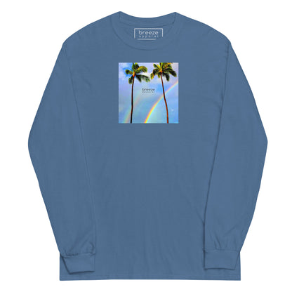 Indigo-blue long-sleeved shirt with a graphic of palm trees, rainbow, and a clear blue sky in the background. A small, black 'breeze apparel' logo is between the trees.