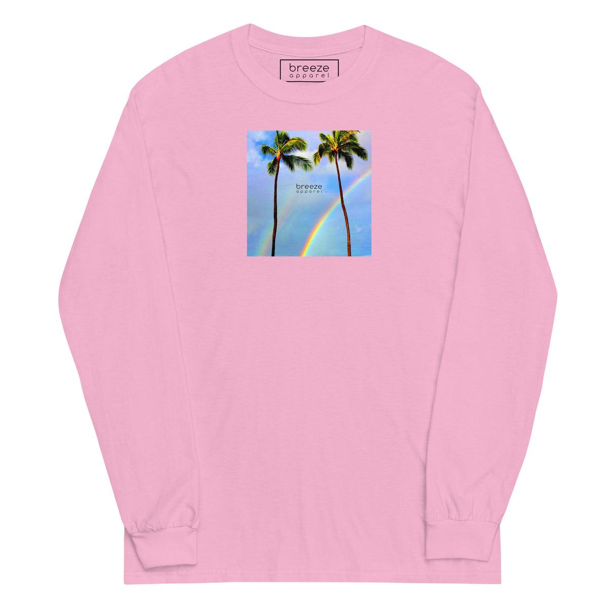 Light-pink long-sleeved shirt with a graphic of palm trees, rainbow, and a clear blue sky in the background. A small, black 'breeze apparel' logo is between the trees.