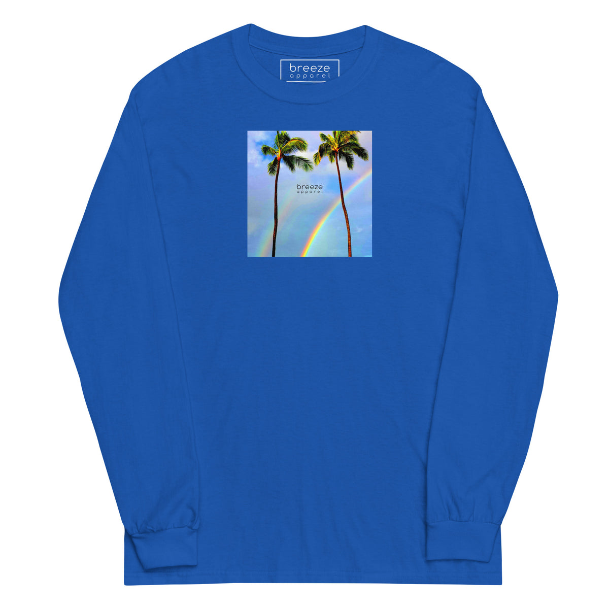 Royal-blue long-sleeved shirt with a graphic of palm trees, rainbow, and a clear blue sky in the background. A small, black 'breeze apparel' logo is between the trees.