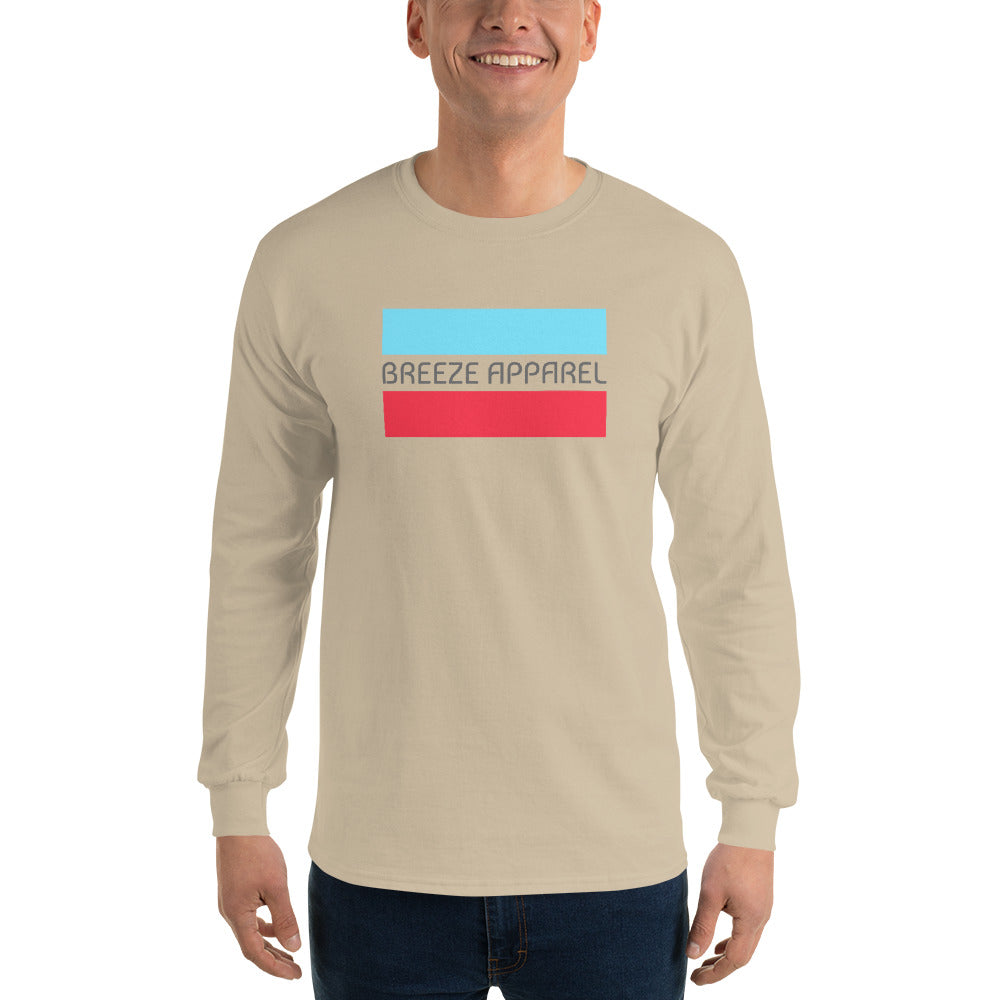 Man wearing sand long-sleeved shirt with gray 'Breeze Apparel' logo between horizontal bars, the top being light blue and the bottom being red.