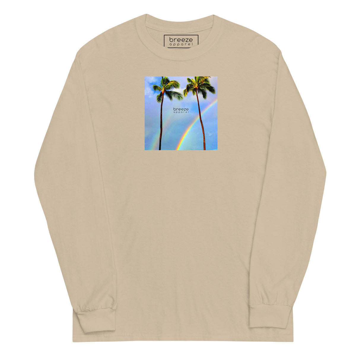 Sand long-sleeved shirt with a graphic of palm trees, rainbow, and a clear blue sky in the background. A small, black 'breeze apparel' logo is between the trees.