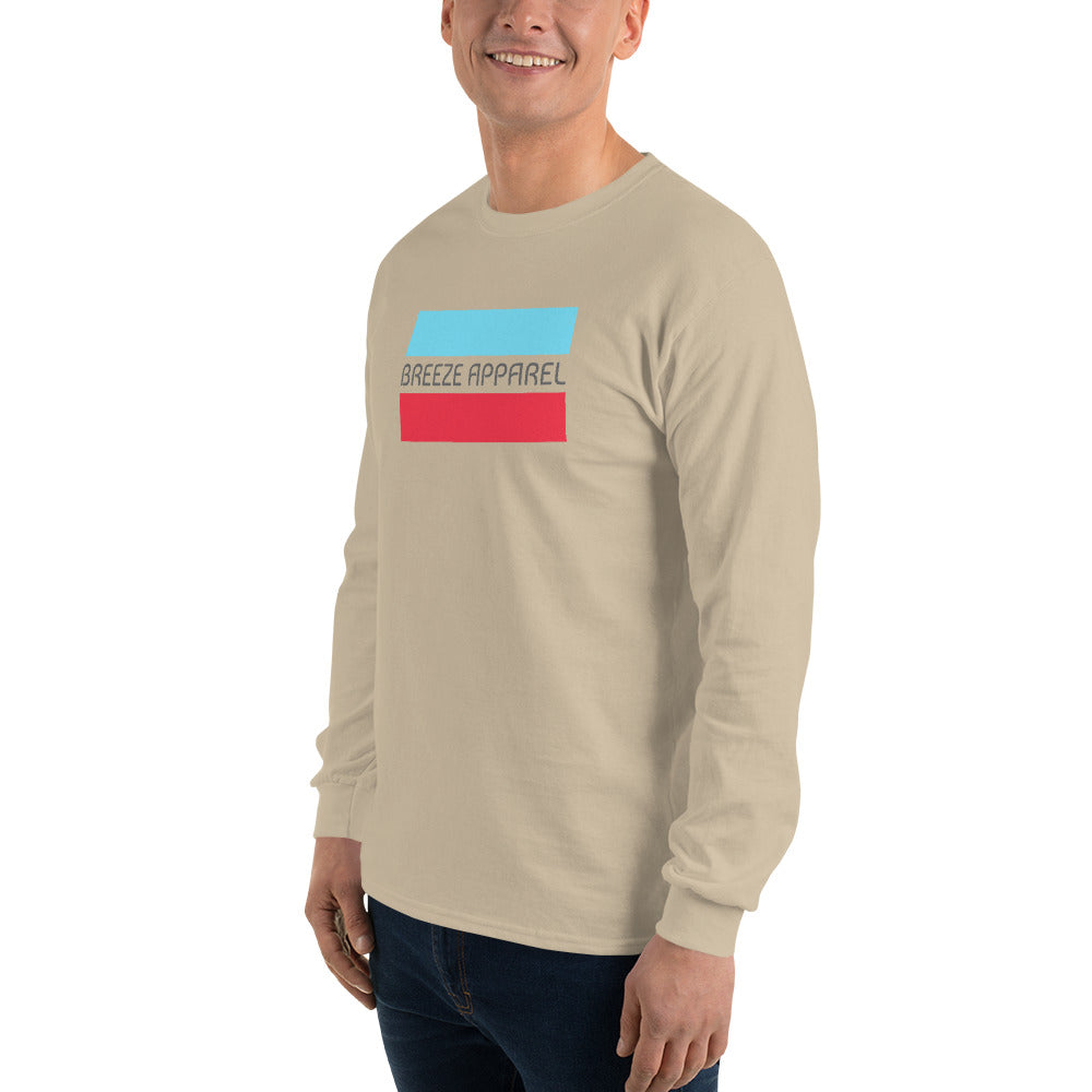 Man wearing sand long-sleeved shirt with gray 'Breeze Apparel' logo between horizontal bars, the top being light blue and the bottom being red.
