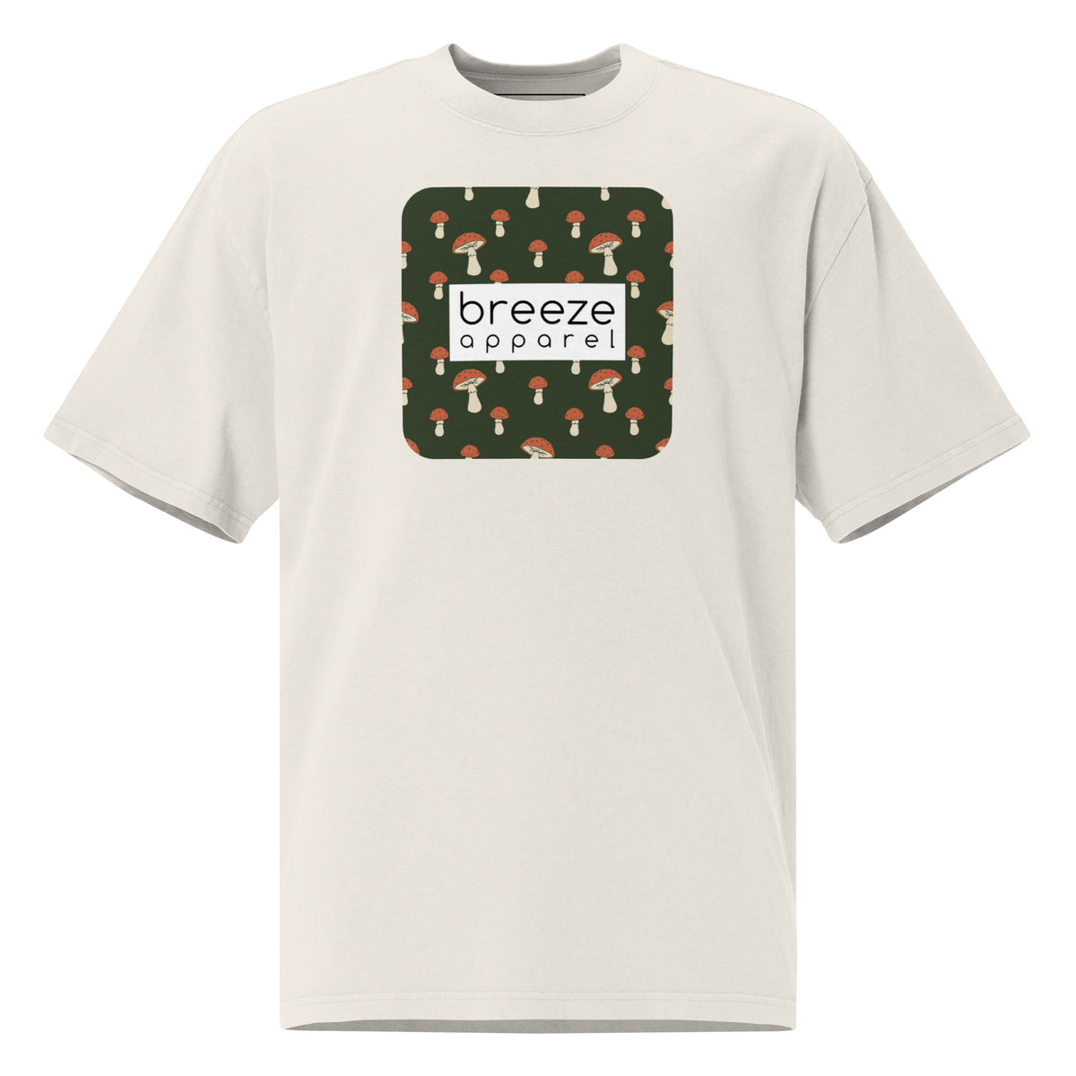 White t-shirt with square graphic of mushrooms on a green background and overlaid with white, rectangular logo.