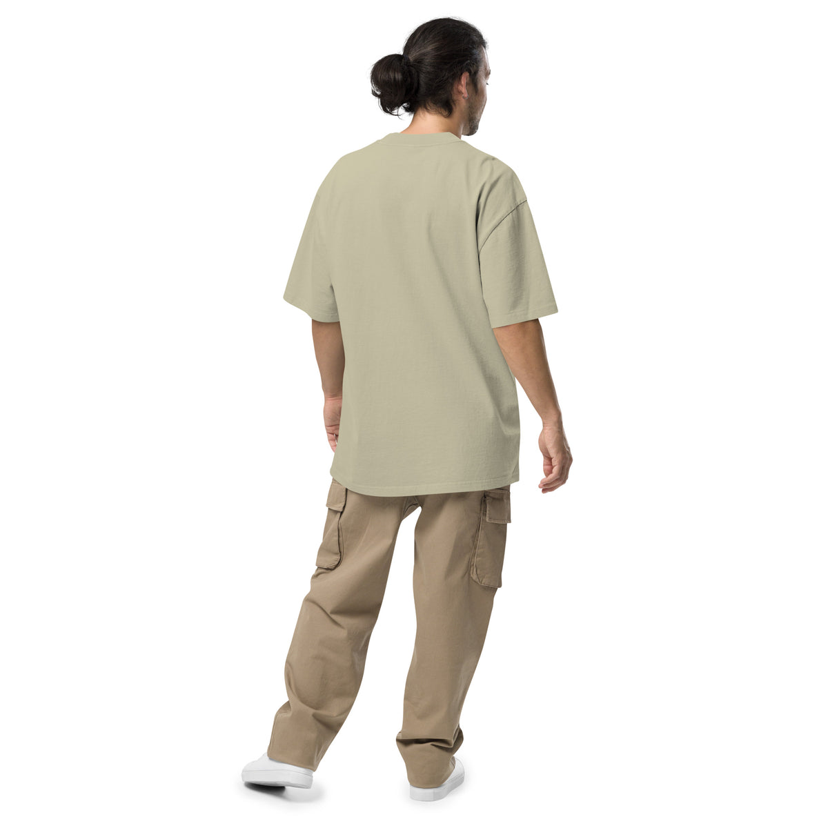 Rear view of man wearing green, oversized t-shirt.