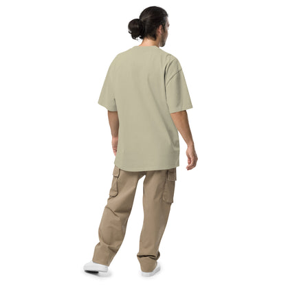 Rear view of man wearing green, oversized t-shirt.