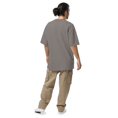 Rear view of man wearing gray oversized t-shirt.