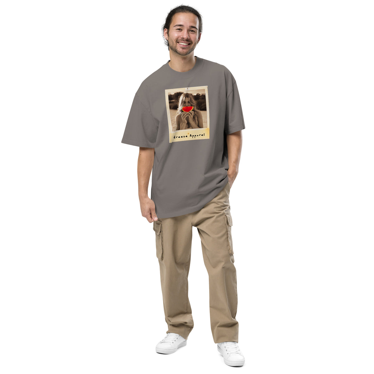 Man wearing gray t-shirt with graphic of woman holding watermelon slice in front of her mouth.