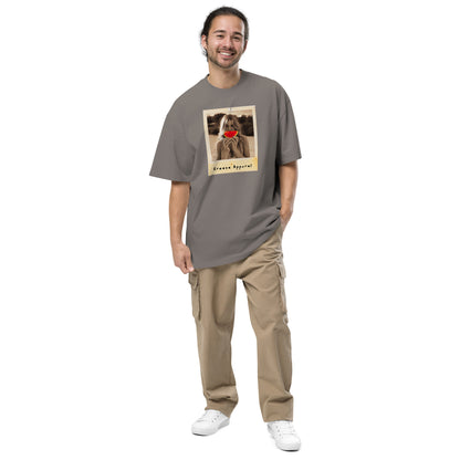 Man wearing gray t-shirt with graphic of woman holding watermelon slice in front of her mouth.