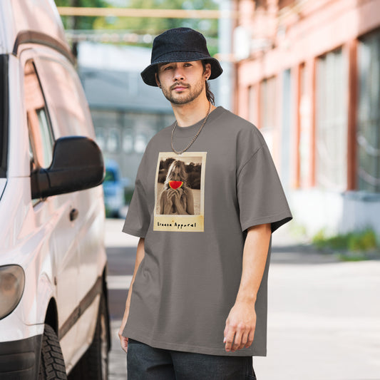 Man wearing gray t-shirt with graphic of woman holding watermelon slice in front of her mouth.